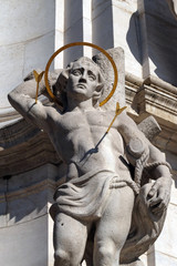 Statue of Saint Sebastian, detail of Holy Trinity plague column in front of Matthias Church in...