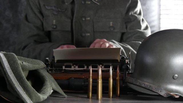 ww2 german soldier using typewriter, de focus concept