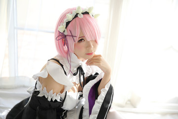 Portrait of Japan anime cosplay woman , white japanese maid in white tone room