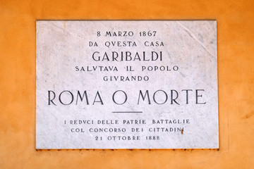 Memorial panel devoted to Italian general, politician and nationalist Giuseppe Garibaldi on the house facade on Piazza Bra in Verona, Italy