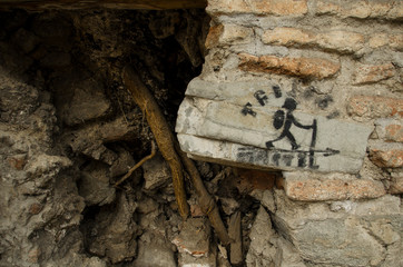 a picture of a tourist on a brick wall_ruins