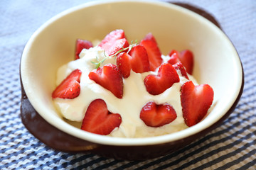 Strawberry with cream on table dessert
