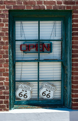 Open neon sign in the window of a vintage cafe on Route 66