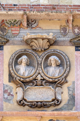 Bass relief on the wall of Palazzo Ragione in Piazza dei Signori in Verona, Italy