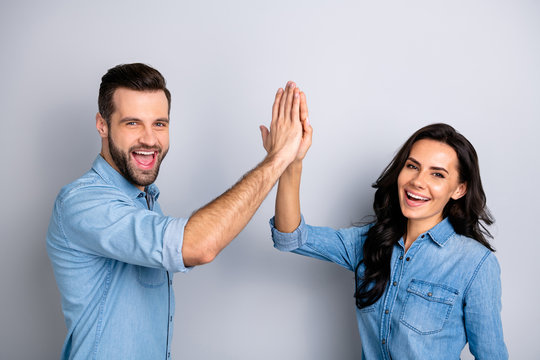 Close up side profile photo amazing she her he him his couple lady guy clapping hands arms teamwork bonding good job work wear casual jeans denim shirts outfit clothes isolated grey background