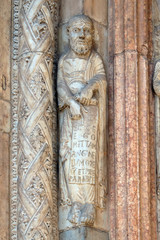 Fototapeta na wymiar Prophet, statue on the portal of the Cathedral dedicated to the Blessed Virgin Mary under the designation Santa Maria Matricolare in Verona, Italy