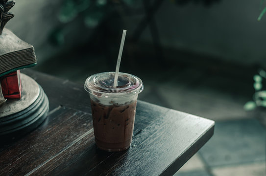A glass of cold cocoa is located on a table in one cafe. 1