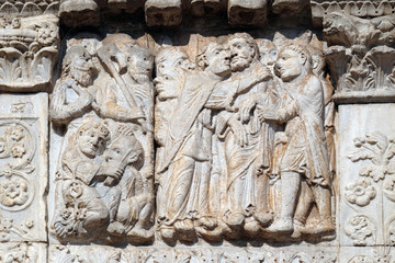 The Kiss of Judas, medieval relief on the facade of Basilica of San Zeno in Verona, Italy