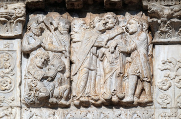 The Kiss of Judas, medieval relief on the facade of Basilica of San Zeno in Verona, Italy