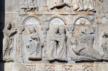 Annunciation, Visitation and Birth of Jesus, medieval relief on the facade of Basilica of San Zeno in Verona, Italy