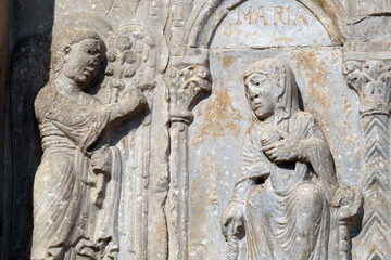 Annunciation of the Virgin Mary, medieval relief on the facade of Basilica of San Zeno in Verona, Italy
