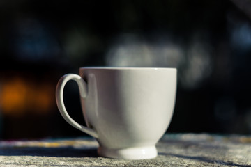 A cup of hot coffee on the table