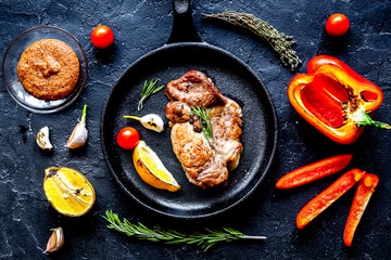 concept cooked steak on dark background top view