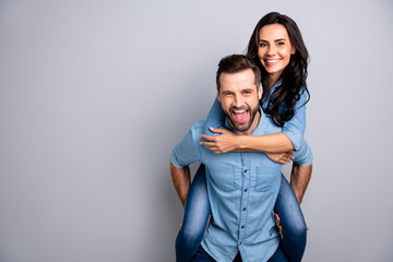 Close up photo funky amazing cheer she her he him his couple lady guy best friends piggyback ride buddies ready party wear casual jeans denim shirts outfit clothes isolated light grey background