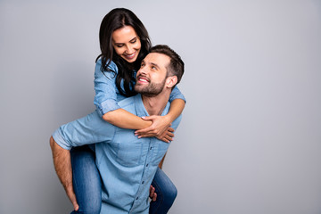 Close up photo funky cheer crazy she her he him his couple in love lady guy best friends piggyback ride buddies fellow wear casual jeans denim shirts outfit clothes isolated light grey background