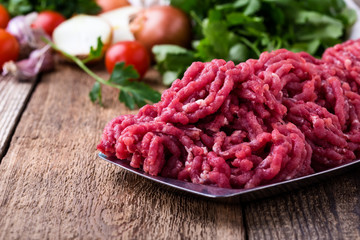 Minced beef, raw ground meat with cooking ingredients