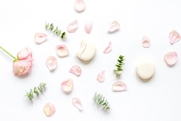 woman table with rose and macaroons in pastel color top view mockup