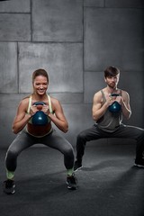 Naklejka premium Young people training in gym