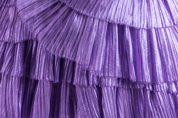 Closeup of a purple tulle dress. Festive colorful clothes.