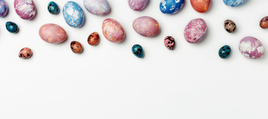 Easter background with different color eggs isolated on white background