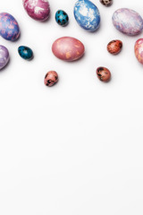 Easter background with different color eggs isolated on white background