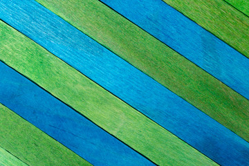 Green diagonal colored wooden background with aquamarine stripes