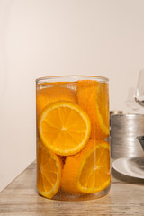 Rustic table setting with pink flowers and candle on light wooden table. Holidays decoration on Provence style. Romantic dinner. Overhead