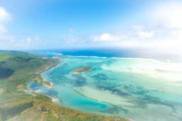 Fototapeta na wymiar blurred aerial picture of a tropical beach in Mauritius, africa