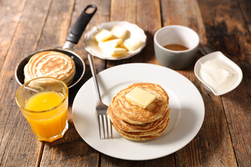 pancake with butter, honey and orange juice