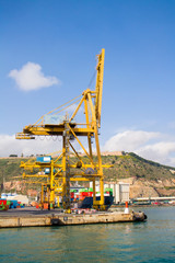 Fototapeta na wymiar Cargo crane in the port of Barcelona, Spain