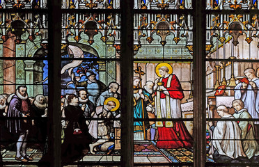 Obraz na płótnie Canvas St. Aloysius Gonzaga receiving first communion from the hands of Saint Charles Borromeo, stained glass window in Saint Severin church in Paris, France 