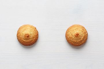 Cookies on a white background, similar to female nipples. Sexy nipples in the form of cookies. Humor, double meaning