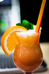 glass of juice orange mint straw