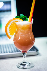 glass of juice orange mint straw