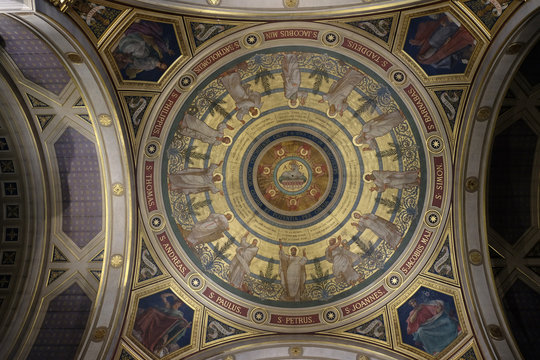 The painting of the cupola represents The Paschal Lamb and the Seven Seals, St Francis Xavier's Church in Paris, France 