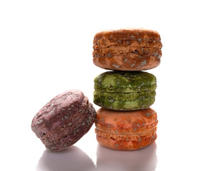 4 pcs moldy macaroons on a white background close up