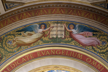 Two Angels Supporting the Book of the Gospels by Romain Cazes, the arch above the altar in the St Francis Xavier's Church in Paris, France 