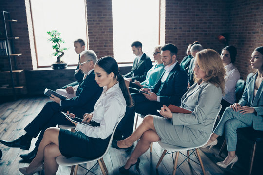 Profile side view of nice serious trendy stylish classy intelligent specialists experts attending educative corporate conference real estate at industrial loft style interior work place station