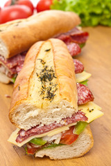 two halves of long baguette sandwich