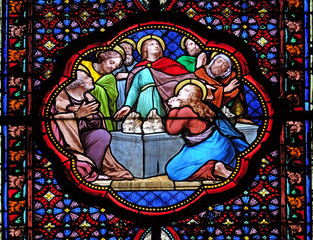 Apostles before empty tomb of Virgin Mary, stained glass window in the Basilica of Saint Clotilde...