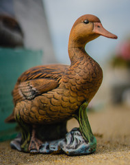 A grave sculpture of a brown duck on a grave. Taken in Louisiana. 