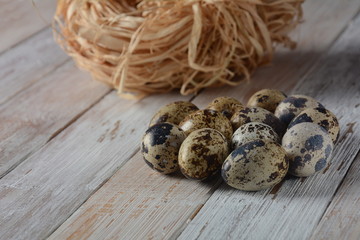 Obraz premium Quail eggs on white background , healthy and diet food, protein concept. Quail eggs isolated. Small colorful quail eggs. Eco products.