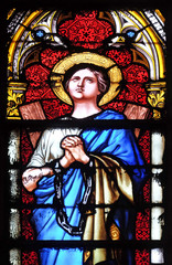 Fototapeta premium Saint Agatha of Sicily, stained glass window in the Basilica of Saint Clotilde in Paris, France