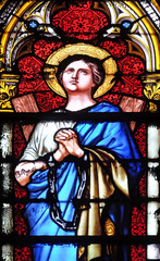 Fototapeta premium Saint Agatha of Sicily, stained glass window in the Basilica of Saint Clotilde in Paris, France
