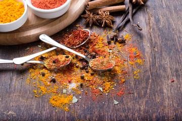 Herbs and spices in ceramic bowls. Aromatic ingredients and natural food additives.