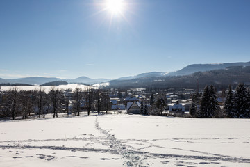 Majestic winter landscape glowing by sunlight in the morning. Dramatic wintry scene.