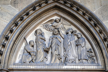 Fototapeta na wymiar Bass relief on the portal of the Basilica of Saint Clotilde in Paris, France 