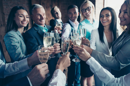 Cropped close up photo business people crowd diversity different age race team building members gathering she her he him his clink golden wine beverage say toasts congrats formal wear jackets shirts