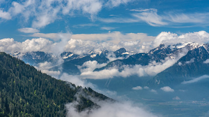 Switzerland, panoramic view on snow Alps with clouds