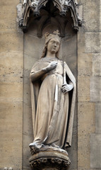 Fototapeta na wymiar Statue of Saint on the portal of the Basilica of Saint Clotilde in Paris, France 